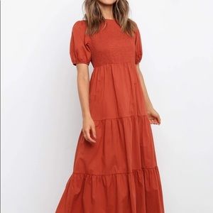 Terracotta red smocked puff sleeve midi dress